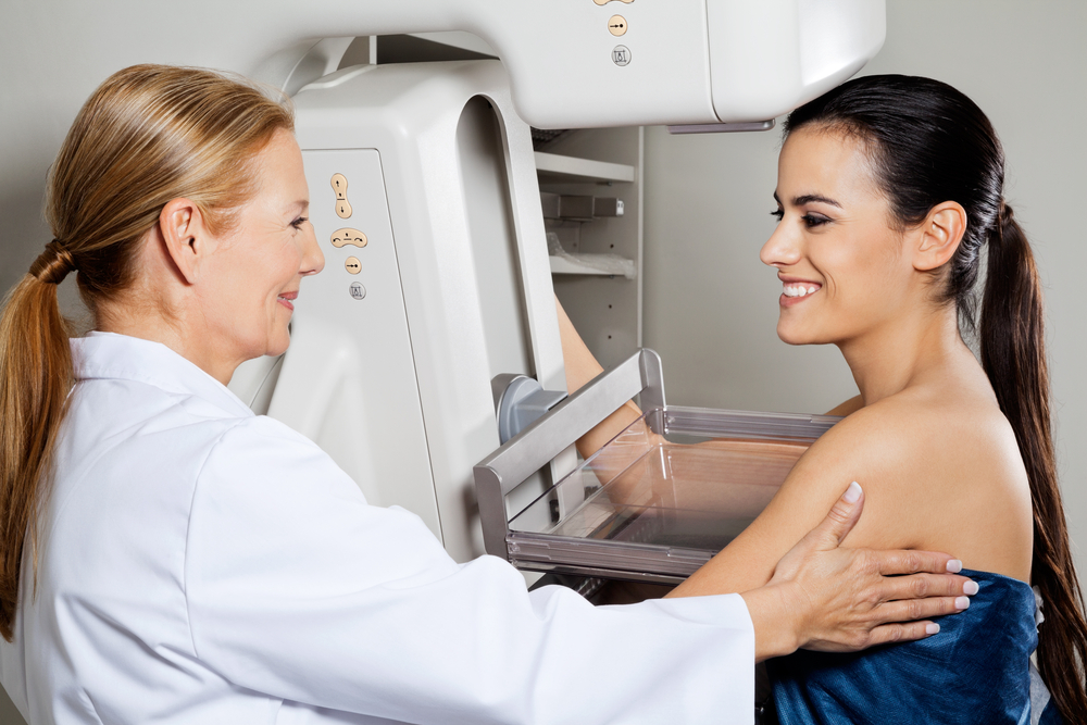 Mature,Female,Doctor,Assisting,Young,Patient,During,Mammogram