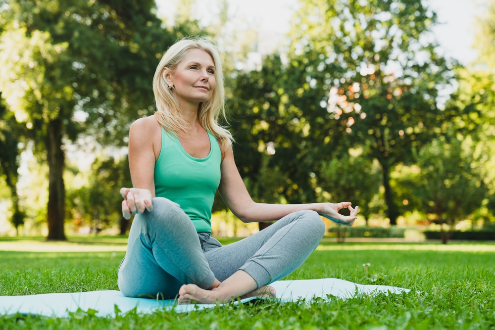 Menopausal woman doing yoga.