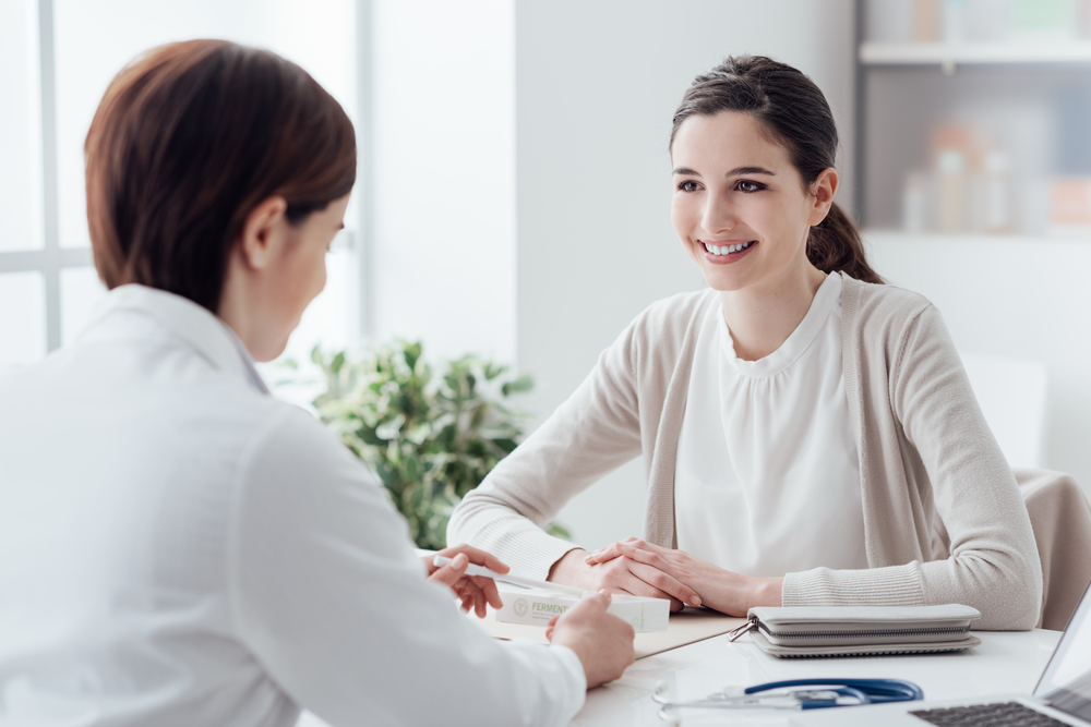 woman talking to female doctor.