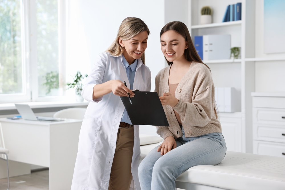 woman talking to female doctor.